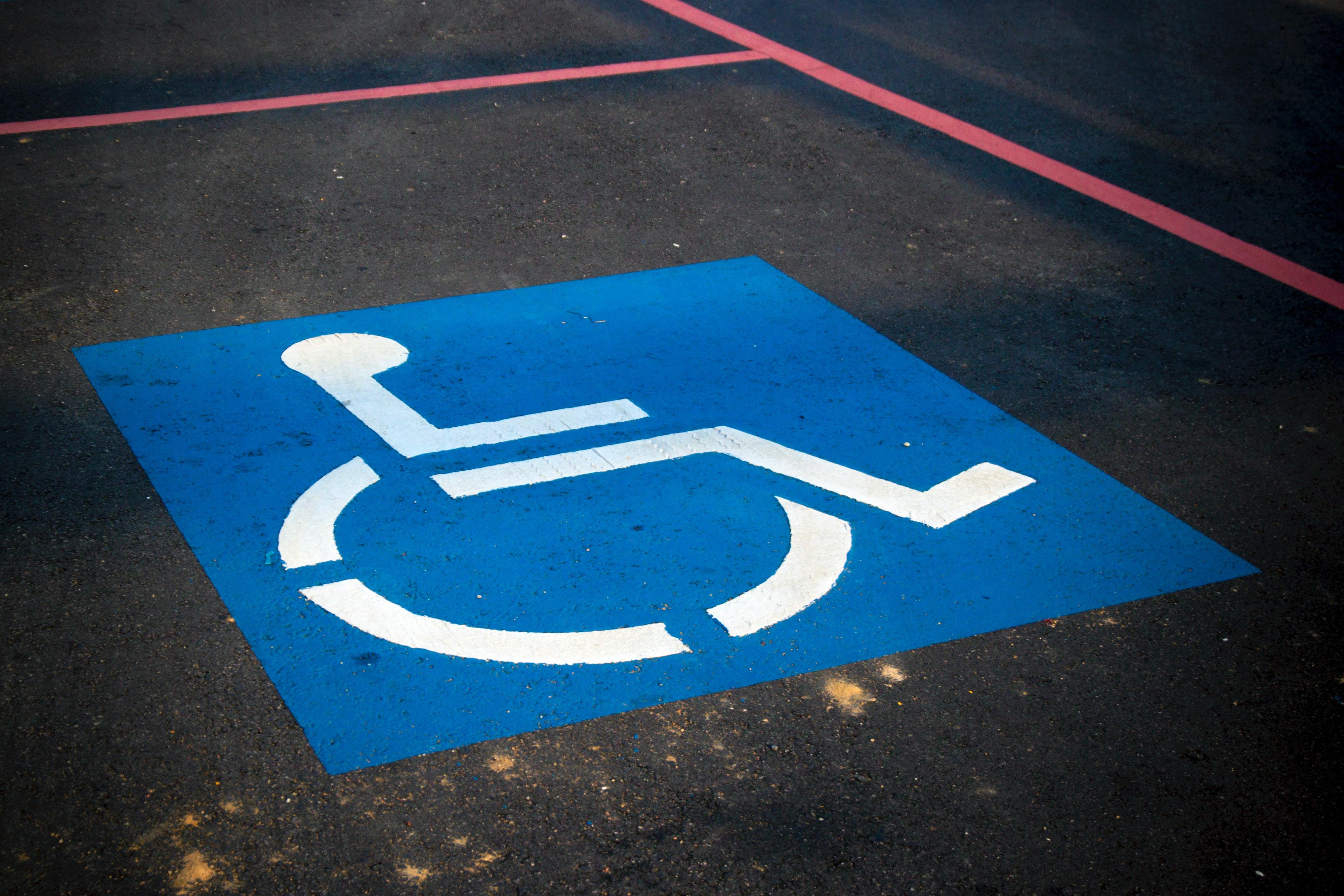 accessible parking signage on the floor of a parking spot 