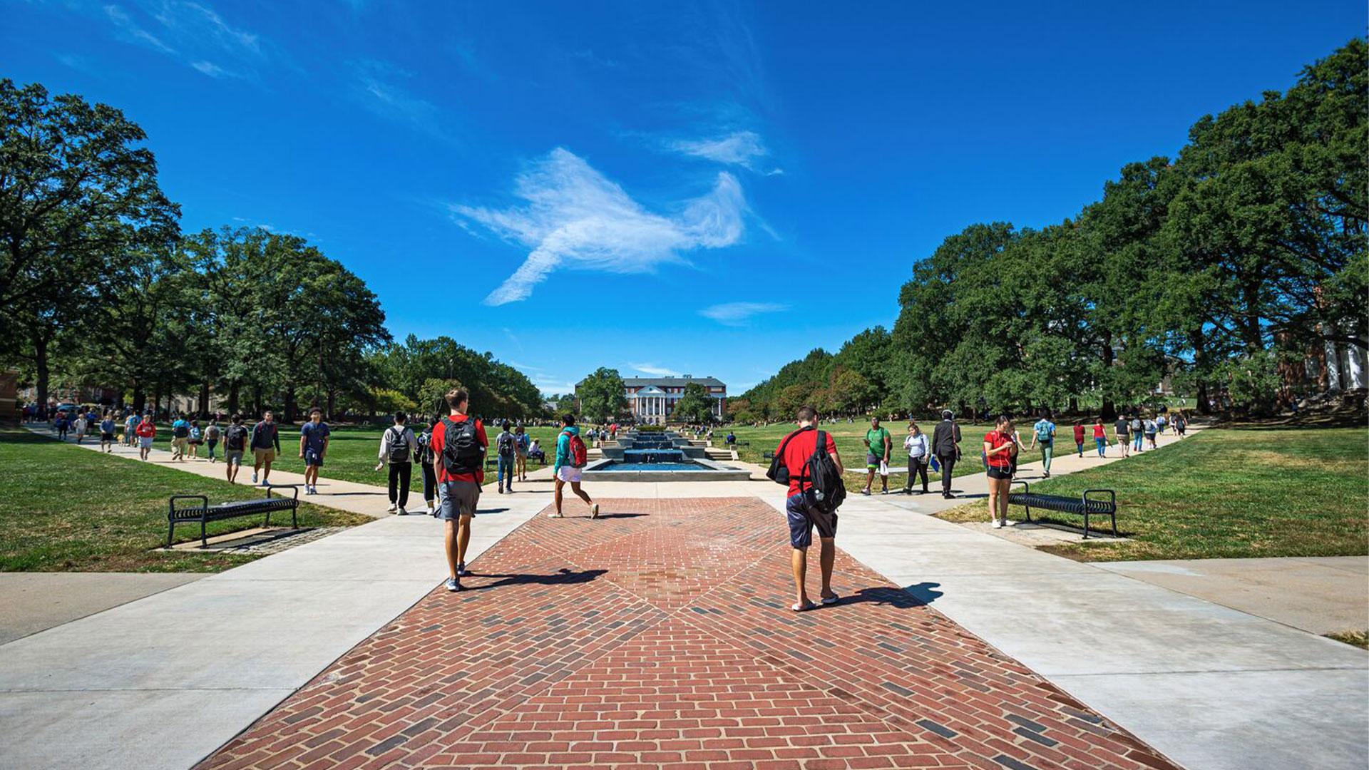 students walking across McKeldin Mall on a sunny day