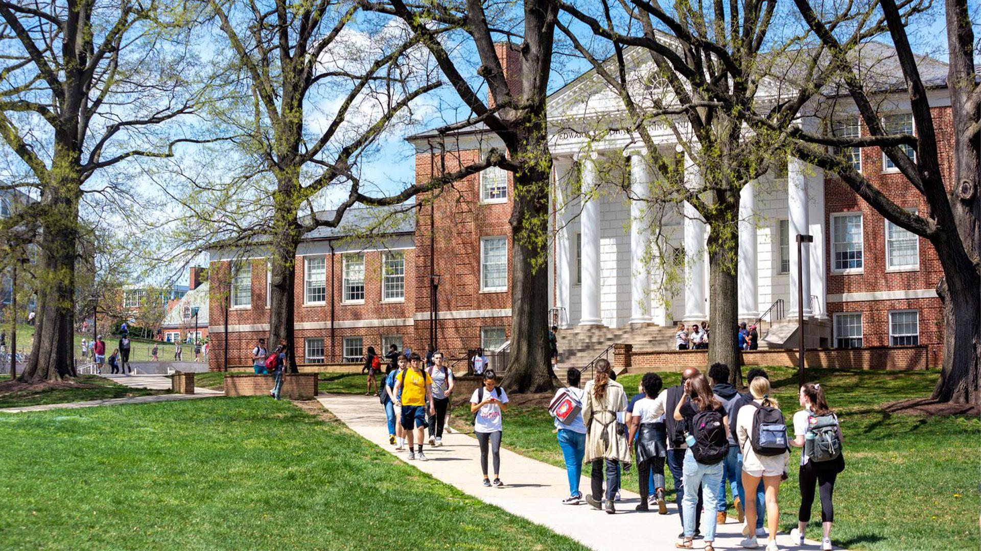 students walking across McKeldin Mall towards ESJ building