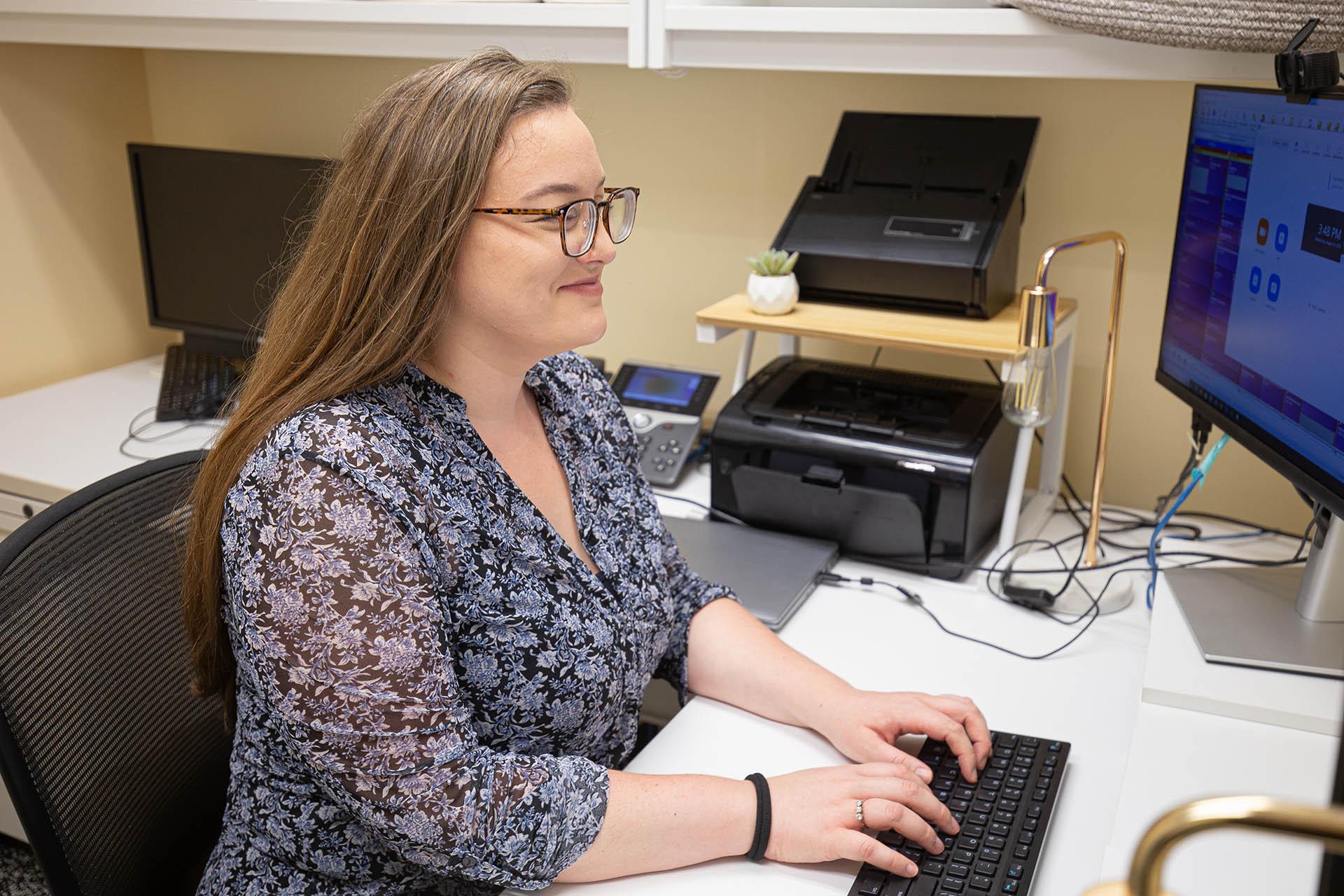 ADS disability specialist working in her office